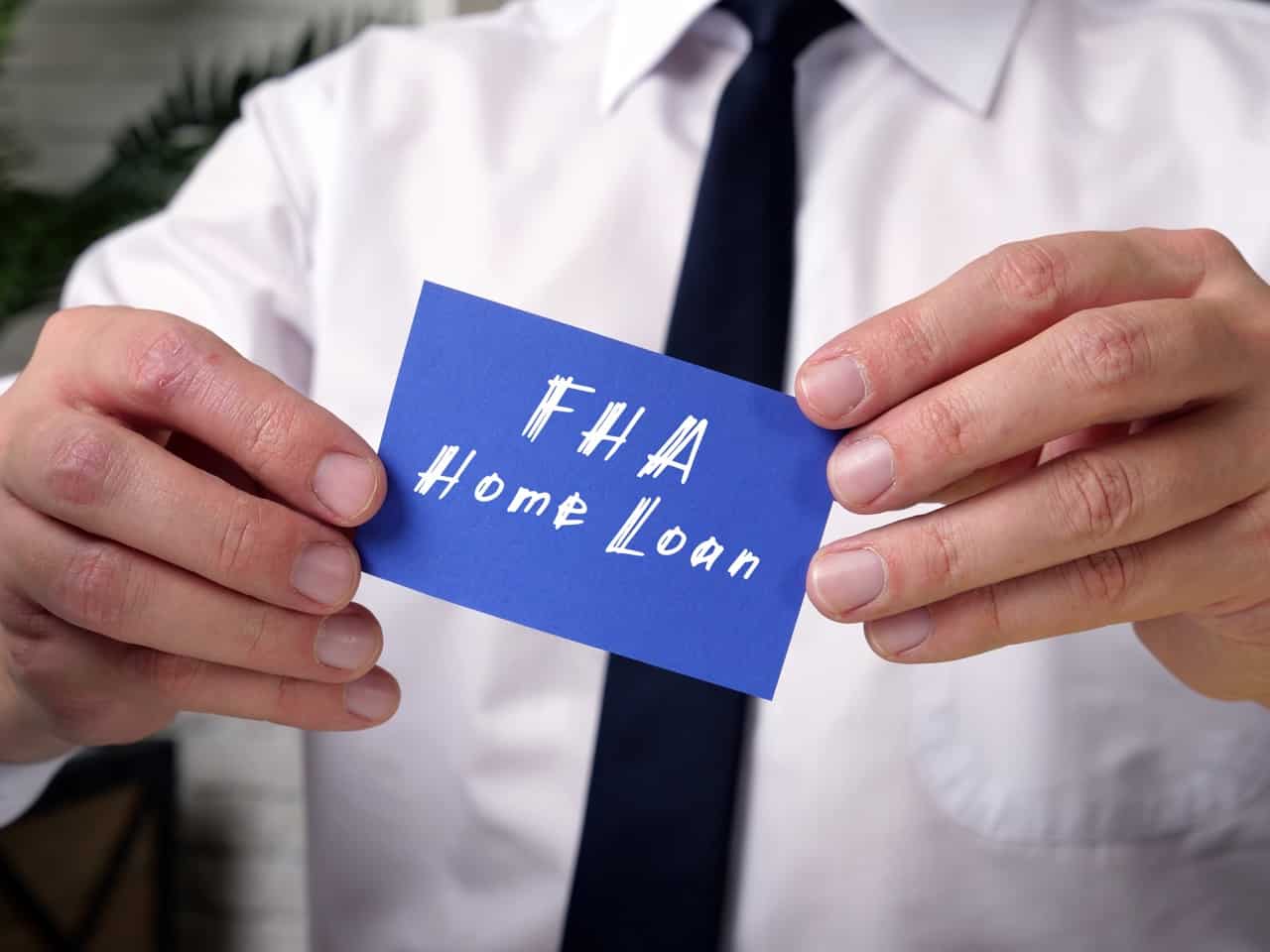Federal Housing Administration FHA Home Loan sign on the piece of paper.